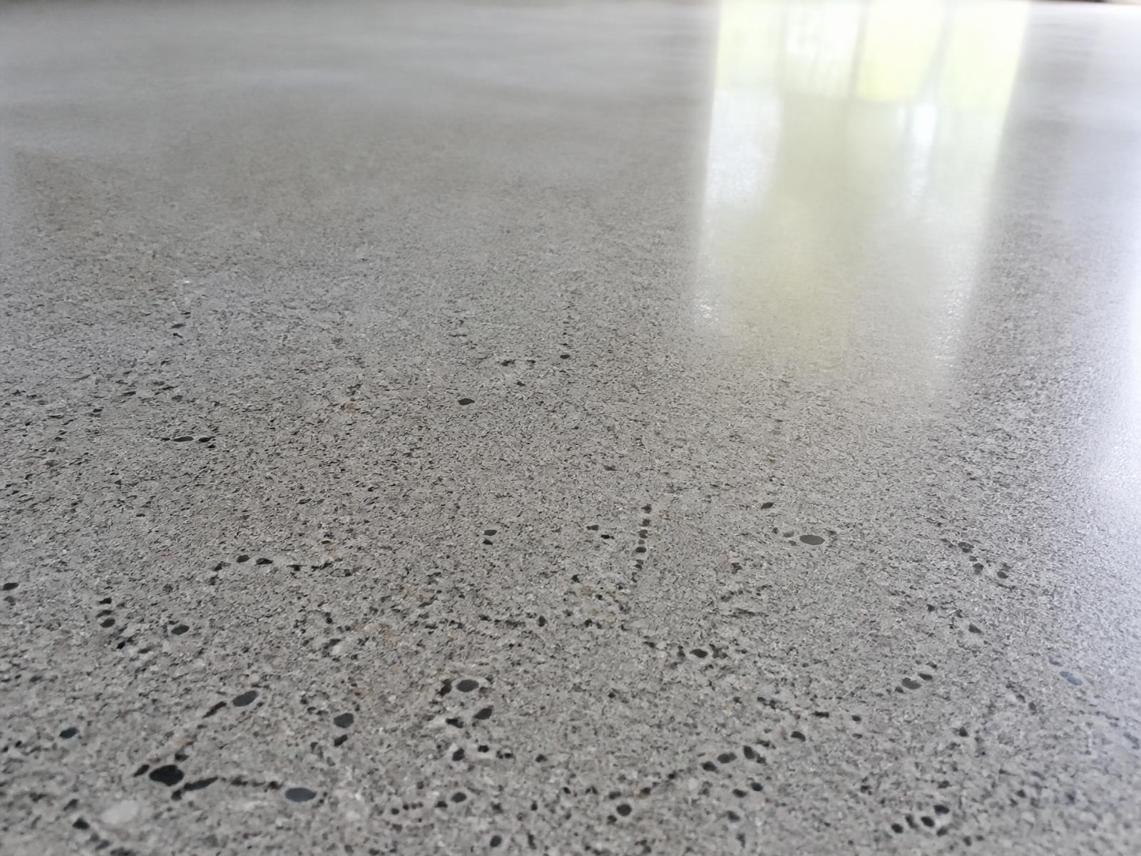 The same garage floor after grinding, polishing and sealing