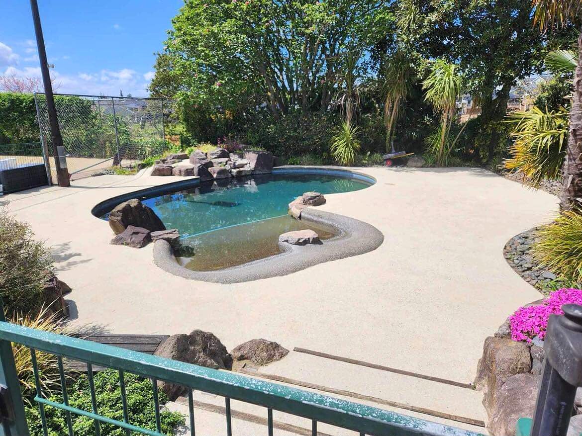 Polished concrete running from an interior floor out to a paved terrace