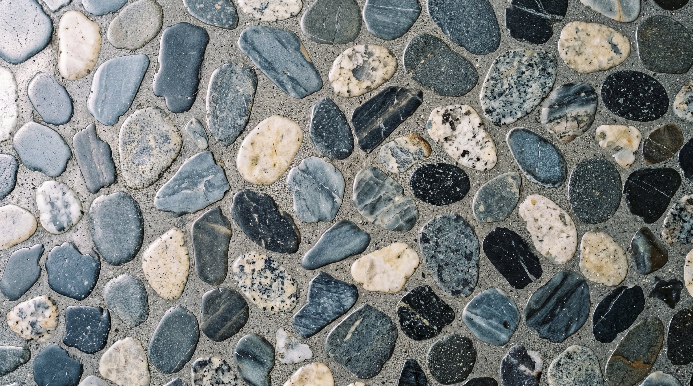 Close view of polished concrete showing exposed sand and stone across the cut surface