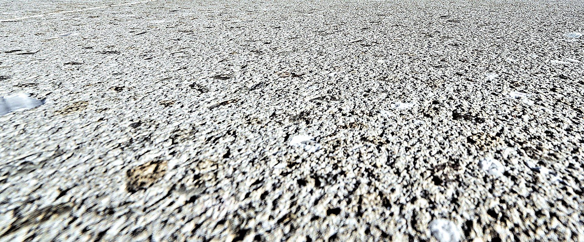 Close view of a bush hammered concrete surface, exposed stone giving an even non slip texture