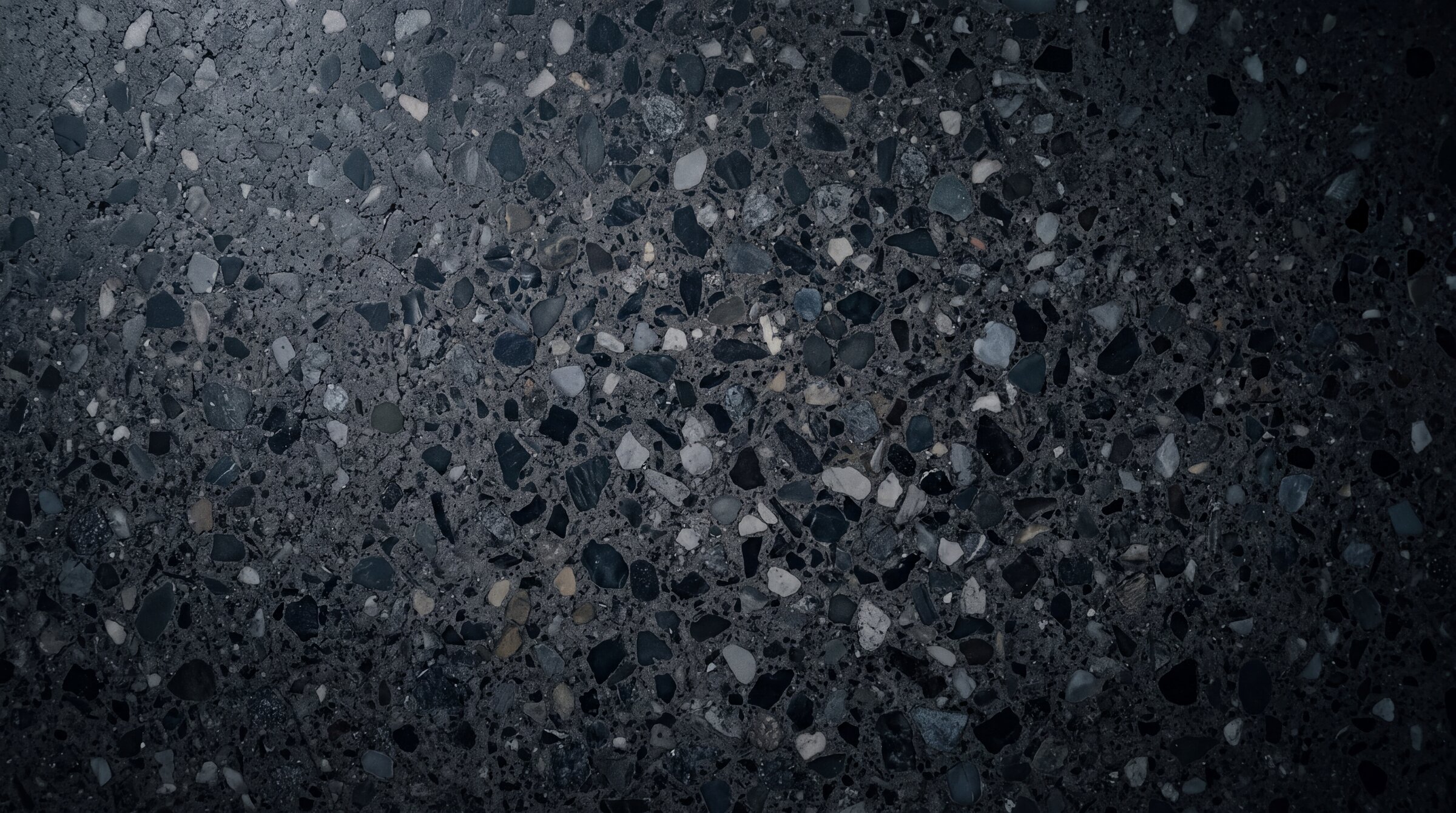 Macro view of a ground concrete surface showing aggregate and cement matrix