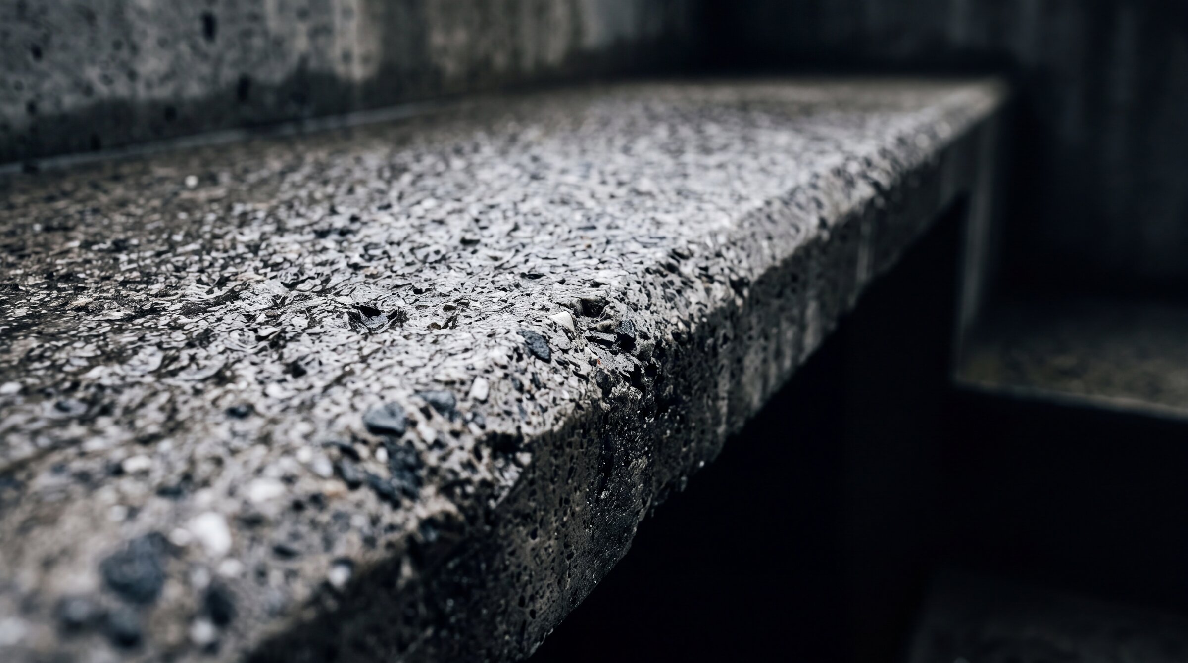 Bush hammered concrete steps with an even textured face